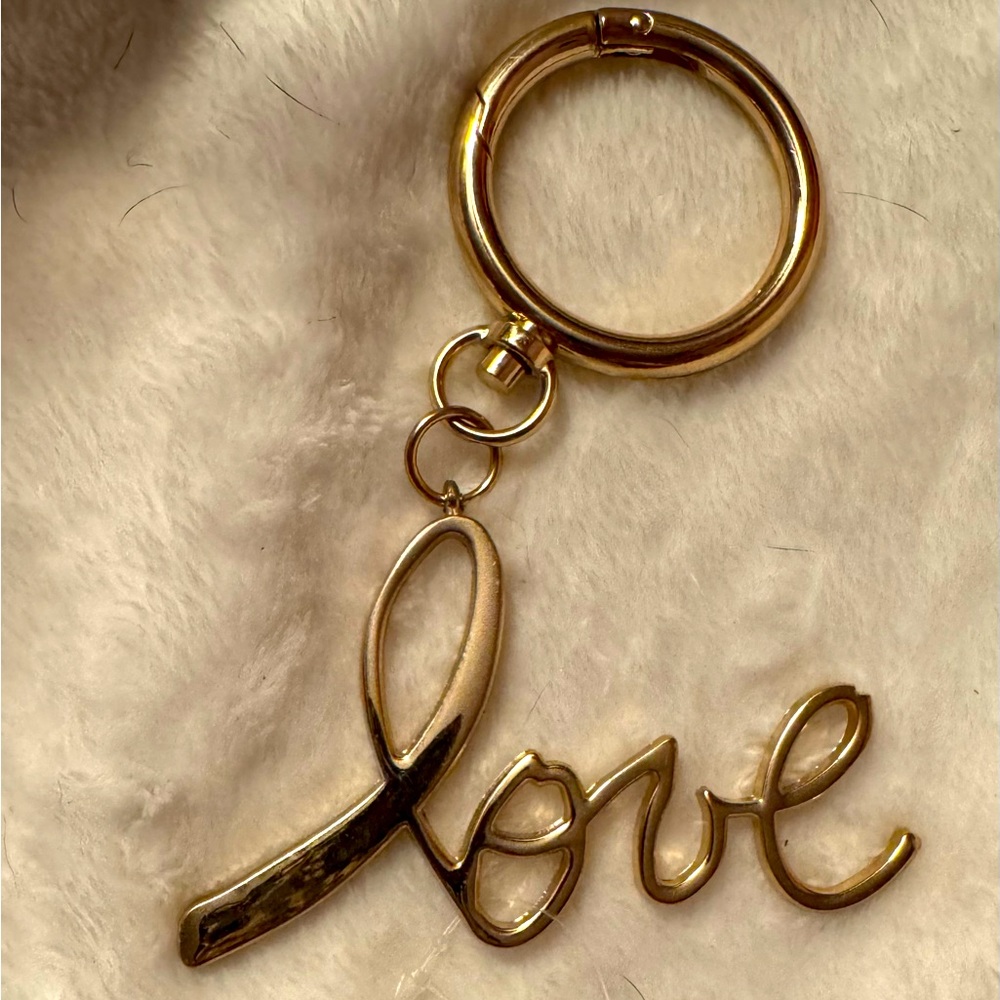 Avon Goldtone Love Keychain/ Bag Charm. NWT